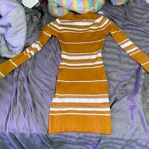 This is a body sweater dress, brownish orange with white stripes and a size XL